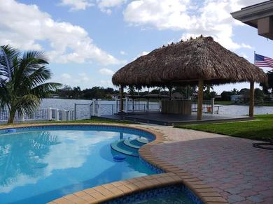 Waterfront 4 bedroom home with heated pool and spa