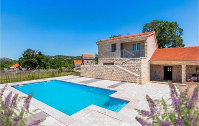 Holiday home Awesome home in Unesic w/ Outdoor swimming pool, WiFi and 3 Bedrooms