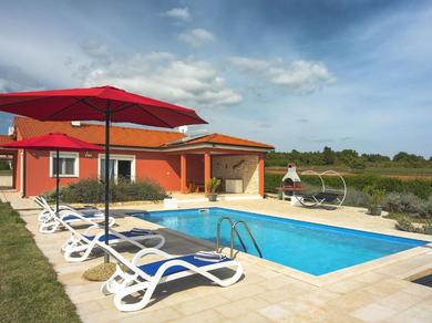 Hotel Detached villa with pool and large garden in quiet area, 1 km from the beach