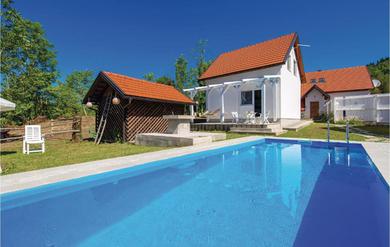 Holiday home Amazing home in Tomici with WiFi, Outdoor swimming pool and 4 Bedrooms