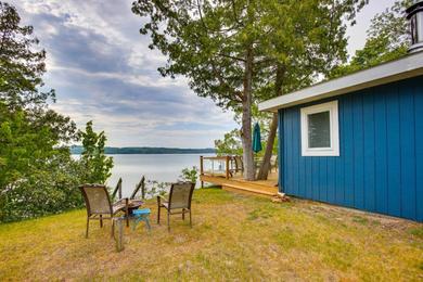 Waterfront Suttons Bay Cottage with Fire Pit!