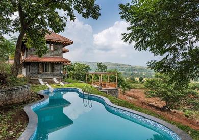 Villa SaffronStays Niramay, Torna-Rajgad - rustic pool villa with a gazebo and great forest views