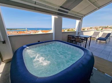 Apartments Vila Novak, One-Bedroom Apartment with Balcony and Sea View has a Jacuzzi on balcony