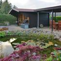 Апартаменты Apartment in the Harz with a log cabin pond and covered seating area