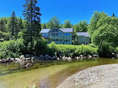 Отель RE90 Rare riverfront family retreat - private slopeside home with AC, fast WiFi, and views