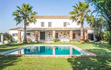 Holiday home Nice home in Coria del Río with Outdoor swimming pool and 4 Bedrooms