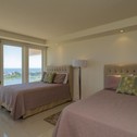 Holiday home Panoramic bayview! Spacious 10th floor condo beachfront resort, shared pools & jacuzzi Pet friendly