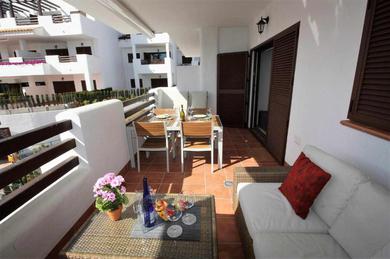 Апартаменты Casa Serena elegante apartamento con balcón y piscina comunitaria