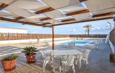 Holiday home Beautiful home in Portopalo di C,P, with 4 Bedrooms, WiFi and Outdoor swimming pool