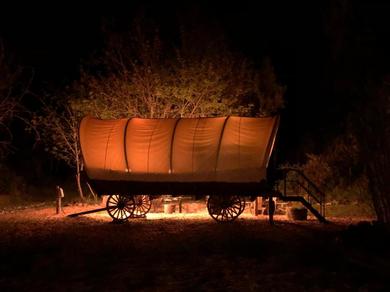  Cozy Wild West Covered Wagon next to River