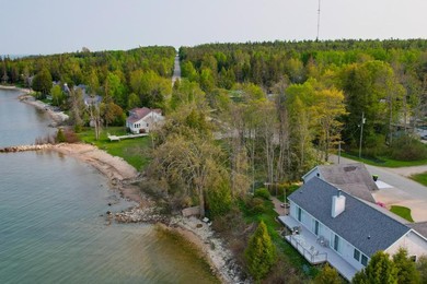 Дом отдыха Lakefront De Tour Village Home with Deck and Fire Pit!