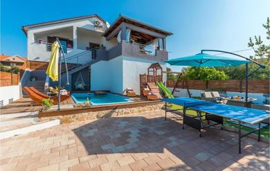 Apartments Amazing apartment in Tinj with Outdoor swimming pool, WiFi and 3 Bedrooms