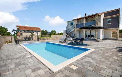 Holiday home Amazing home in Tinj with Outdoor swimming pool, WiFi and 2 Bedrooms