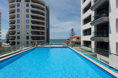 Marvelous Downtown Apartment Moments from Main Beach with Heated Pool, Gym and Parking