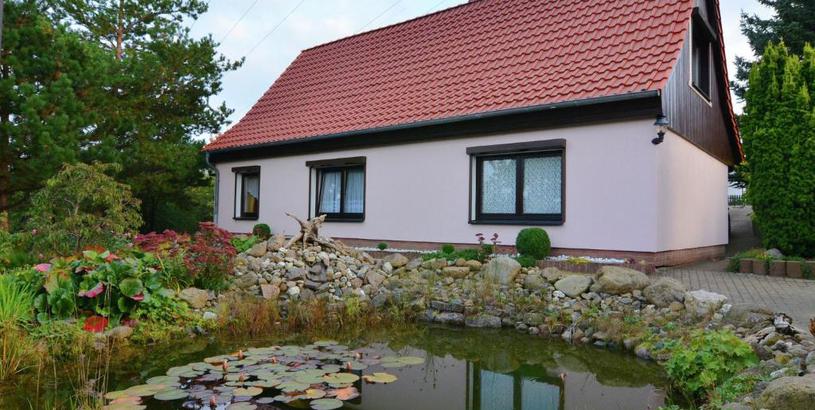 Апартаменты Apartment in the Harz with a log cabin pond and covered seating area
