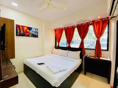 Hotel Deluxe Inn - Stay Near Kokilaben Dhirubhai Ambani Hospital